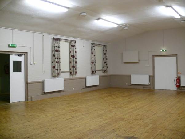 A room with a wooden floor and doors
AI-generated content may be incorrect.